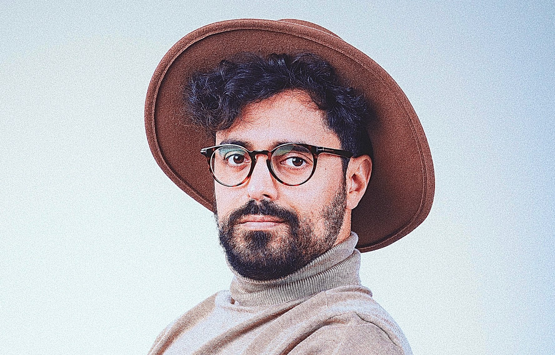 Portrait of Art wearing a brown wide-brimmed hat